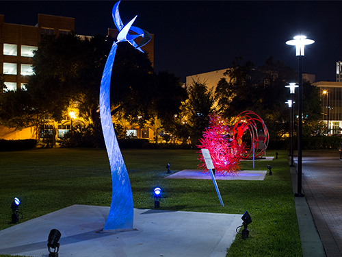 Sculpture on the Orange County administrative building lawn at night