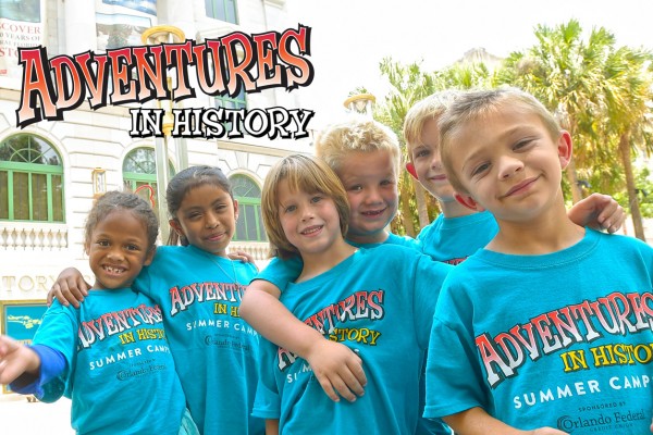 Children standing for a photo in front of the Orange County Regional History Center