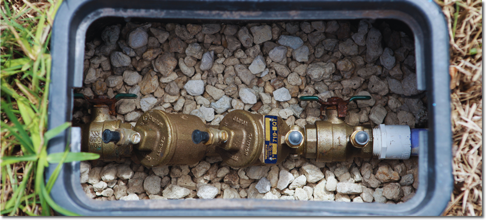 Photo of a water valve system in the ground